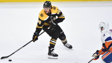 May 29, 2021; Boston, MA, USA; Boston Bruins right wing David Pastrnak (88) controls the puck while New York Islanders defenseman Noah Dobson (8) defends during the third period in game one of the second round of the 2021 Stanley Cup Playoffs at TD Garden. Mandatory Credit: Bob DeChiara-USA TODAY Sports
