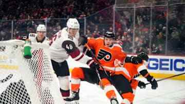 PHILADELPHIA, PA - DECEMBER 05: Arizona Coyotes Defenceman Ilya Lyubushkin (46) clears the crease in front of the Coyote goal taking down Philadelphia Flyers Center Morgan Frost (48) in the process during the game between the Phoenix Coyotes and the Philadelphia Flyers on December 5, 2019 at the Wells Fargo Center in Philadelphia, Pennsylvania. (Photo by Nicole Fridling/Icon Sportswire via Getty Images)