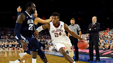 Apr 2, 2016; Houston, TX, USA; Oklahoma Sooners guard Buddy Hield (24) drives to the basket against Villanova Wildcats forward Daniel Ochefu (23) during the second half in the 2016 NCAA Men