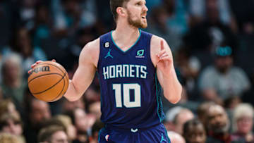 CHARLOTTE, NORTH CAROLINA - APRIL 02: Svi Mykhailiuk #10 of the Charlotte Hornets brings the ball up court against the Toronto Raptors in the third quarter during their game at Spectrum Center on April 02, 2023 in Charlotte, North Carolina. NOTE TO USER: User expressly acknowledges and agrees that, by downloading and or using this photograph, User is consenting to the terms and conditions of the Getty Images License Agreement. (Photo by Jacob Kupferman/Getty Images)