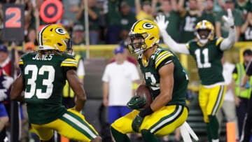Sep 18, 2022; Green Bay, Wisconsin, USA; Green Bay Packers wide receiver Allen Lazard (13) celebrates scoring a touchdown with running back Aaron Jones (33) in the second quarter during their football game at Lambeau Field.Nfl Chicago Bears At Green Bay Packers