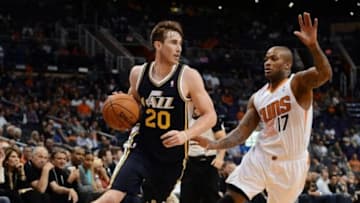 Nov 1, 2013; Phoenix, AZ, USA; Utah Jazz forward Gordon Hayward (20) handles the ball against the Phoenix Suns forward P.J Tucker (17) in the second half at US Airways Center. The Suns defeated the Jazz 87-84. Mandatory Credit: Jennifer Stewart-USA TODAY Sports