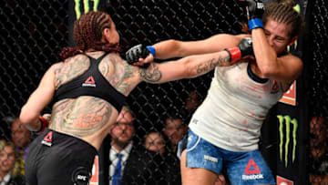 EDMONTON, ALBERTA - JULY 27: (L-R) Cris Cyborg of Brazil punches Felicia Spencer of Canada in their featherweight bout during the UFC 240 event at Rogers Place on July 27, 2019 in Edmonton, Alberta, Canada. (Photo by Jeff Bottari/Zuffa LLC/Zuffa LLC)