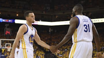 May 18, 2016; Oakland, CA, USA; Golden State Warriors guard Stephen Curry (30) celebrates with center Festus Ezeli (31) against the Oklahoma City Thunder during the second quarter in game two of the Western conference finals of the NBA Playoffs at Oracle Arena. Mandatory Credit: Kyle Terada-USA TODAY Sports