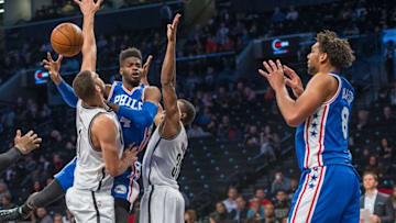 Oct 18, 2015; Brooklyn, NY, USA; Philadelphia 76ers center Nerlens Noel (4) passes the ball to Philadelphia 76ers center Jahlil Okafor (8) with Brooklyn Nets center Brook Lopez (11) and Brooklyn Nets small forward Thaddeus Young (30) defending during the 2nd qtr at Barclays Center. The Nets won 92-91. Mandatory Credit: Gregory J. Fisher-USA TODAY Sports