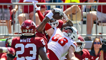 Sep 18, 2021; Norman, Oklahoma, USA; Oklahoma Sooners cornerback D.J. Graham (middle) makes an interception in front of Nebraska Cornhuskers wide receiver Levi Falck (88) during the fourth quarter at Gaylord Family-Oklahoma Memorial Stadium. Mandatory Credit: Kevin Jairaj-USA TODAY Sports
