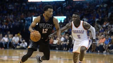 Oct 28, 2016; Oklahoma City, OK, USA; Phoenix Suns forward T.J. Warren (12) drives to the basket in front of Oklahoma City Thunder guard Victor Oladipo (5) during the fourth quarter at Chesapeake Energy Arena. Mandatory Credit: Mark D. Smith-USA TODAY Sports