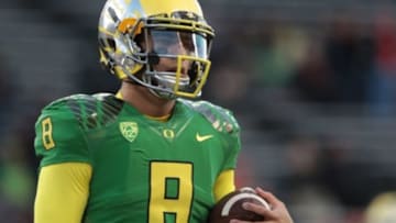 Nov 29, 2014; Corvallis, OR, USA; Oregon Ducks quarterback Marcus Mariota (8) hold the ball before the game against the Oregon State Beavers at Reser Stadium. Mandatory Credit: Scott Olmos-USA TODAY Sports