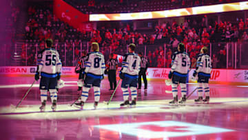 Oct 8, 2021; Calgary, Alberta, CAN; Winnipeg Jets starting lineup during the national anthem prior to a game against the Calgary Flames at Scotiabank Saddledome. Mandatory Credit: Sergei Belski-USA TODAY Sports