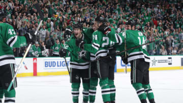 DALLAS, TX - MARCH 17: Taylor Fedun #42, Roope Hintz #24, Jamie Benn #14 and the Dallas Stars celebrate a goal against the Vancouver Canucks at the American Airlines Center on March 17, 2019 in Dallas, Texas. (Photo by Glenn James/NHLI via Getty Images)