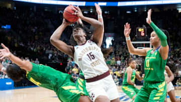 PORTLAND, OR - MARCH 31: Mississippi State Bulldogs center Teaira McCowan (15) gets fouled by Oregon Ducks forward Ruthy Hebard (24) during the NCAA Division I Women's Championship Elite Eight round basketball game between the Oregon Ducks and Mississippi State Bulldogs on March 31, 2019 at Moda Center in Portland, Oregon. (Photo by Joseph Weiser/Icon Sportswire via Getty Images)