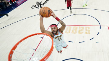 Jun 12, 2023; Denver, Colorado, USA; Denver Nuggets forward Bruce Brown (11) dunks against the Miami Heat during the first half in game five of the 2023 NBA Finals at Ball Arena. Mandatory Credit: Jack Dempsey/Pool Photo-USA TODAY Sports