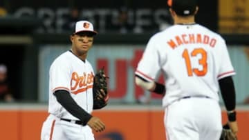 May 5, 2016; Baltimore, MD, USA; Baltimore Orioles second baseman Jonathan Schoop (6) looks at shortstop Manny Machado (13) after an infield single in the third inning against the New York Yankees at Oriole Park at Camden Yards. Mandatory Credit: Evan Habeeb-USA TODAY Sports