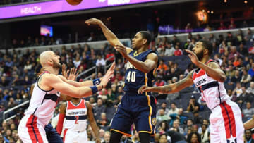 Dec 28, 2016; Washington, DC, USA; Indiana Pacers guard Glenn Robinson III (40) passes the ball against Washington Wizards center Marcin Gortat (13) and forward Markieff Morris (5) during the first half at Verizon Center. Mandatory Credit: Brad Mills-USA TODAY Sports