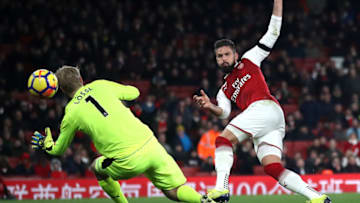 LONDON, ENGLAND - NOVEMBER 29: Olivier Giroud of Arsenal scores his sides fifth goal past Jonas Lossl of Huddersfield Town during the Premier League match between Arsenal and Huddersfield Town at Emirates Stadium on November 29, 2017 in London, England. (Photo by Julian Finney/Getty Images)