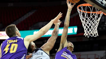 Jul 8, 2016; Las Vegas, NV, USA; Los Angeles Lakers forward Brandon Ingram (14) shoots inside the defense of New Orleans Pelicans center Liam McMorrow (50) during an NBA Summer League game at Thomas & Mack Center. Los Angeles won the game 85-65. Mandatory Credit: Stephen R. Sylvanie-USA TODAY Sports