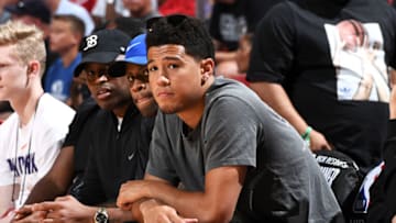 LAS VEGAS, NV - JULY 9: Devin Booker #1 of the Phoenix Suns attends the game between the Phoenix Suns and Orlando Magic during the 2018 Las Vegas Summer League on July 9, 2018 at the Thomas & Mack Center in Las Vegas, Nevada. NOTE TO USER: User expressly acknowledges and agrees that, by downloading and or using this Photograph, user is consenting to the terms and conditions of the Getty Images License Agreement. Mandatory Copyright Notice: Copyright 2018 NBAE (Photo by Garrett Ellwood/NBAE via Getty Images)
