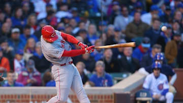 Apr 11, 2016; Chicago, IL, USA; Cincinnati Reds shortstop Zack Cozart (2) hits a single during the first inning against the Chicago Cubs at Wrigley Field. Mandatory Credit: Dennis Wierzbicki-USA TODAY Sports