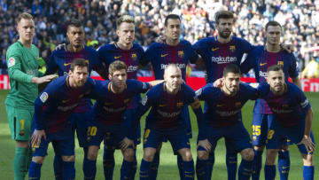 (FromL, up) Barcelona's German goalkeeper Marc-Andre Ter Stegen, Barcelona's Brazilian midfielder Paulinho, Barcelona's Croatian midfielder Ivan Rakitic, Barcelona's Spanish midfielder Sergio Busquets, Barcelona's Spanish defender Gerard Pique and Barcelona's Belgian defender Thomas Vermaelen, (down) Barcelona's Argentinian forward Lionel Messi, Barcelona's Spanish midfielder Sergi Roberto, Barcelona's Spanish midfielder Andres Iniesta, Barcelona's Uruguayan forward Luis Suarez and Barcelona's Spanish defender Jordi Alba pose before the Spanish League 'Clasico' football match Real Madrid CF vs FC Barcelona at the Santiago Bernabeu stadium in Madrid on December 23, 2017. / AFP PHOTO / CURTO DE LA TORRE (Photo credit should read CURTO DE LA TORRE/AFP/Getty Images)