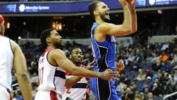 Nov 14, 2015; Washington, DC, USA; Orlando Magic forward Evan Fournier (10) shoots the ball in front of Washington Wizards guard Garrett Temple (17) during the first half at Verizon Center. Mandatory Credit: Brad Mills-USA TODAY Sports