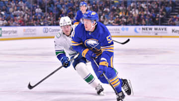 Nov 15, 2022; Buffalo, New York, USA; Buffalo Sabres left wing Jeff Skinner (53) skates the puck past Vancouver Canucks right wing Conor Garland (8) in the second period at KeyBank Center. Mandatory Credit: Mark Konezny-USA TODAY Sports