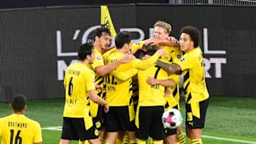 Borussia Dortmund players celebrate after Dortmund's Marco Reus' goal (Photo by Martin Meissner - Pool/Getty Images)