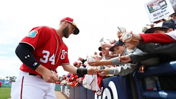 Mar 21, 2016; Melbourne, FL, USA; Washington Nationals right fielder Bryce Harper (34) signs autographs prior to a game against the Houston Astros at Space Coast Stadium. Mandatory Credit: Logan Bowles-USA TODAY Sports
