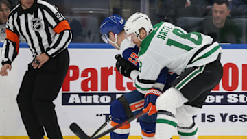 Mar 19, 2022; Elmont, New York, USA; New York Islanders center Casey Cizikas (53) and Dallas Stars left wing Michael Raffl (18) battle for a loose puck during the second period at UBS Arena. Mandatory Credit: Andy Marlin-USA TODAY Sports