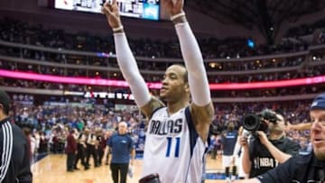 Apr 12, 2014; Dallas, TX, USA; Dallas Mavericks guard Monta Ellis (11) and his team celebrate the win over the Phoenix Suns at the American Airlines Center. The Mavericks defeated the Suns 101-98 and clinched a spot in the NBA playoffs. Mandatory Credit: Jerome Miron-USA TODAY Sports