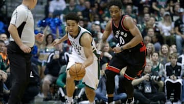 MILWAUKEE, WI - APRIL 22: Malcolm Brogdon #13 of the Milwaukee Bucks dribbles the basketball up the court with DeMar DeRozan of the Toronto Raptors defending during the first half of Game Four of the Eastern Conference Quarterfinals during the 2017 NBA Playoffs at the BMO Harris Bradley Center on April 22, 2017 in Milwaukee, Wisconsin. NOTE TO USER: User expressly acknowledges and agrees that, by downloading and or using the photograph, User is consenting to the terms and conditions of the Getty Images License Agreement. (Photo by Mike McGinnis/Getty Images)