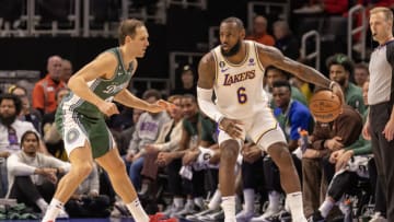 Dec 11, 2022; Detroit, Michigan, USA; Los Angeles Lakers forward LeBron James (6) controls the ball as Detroit Pistons forward Bojan Bogdanovic (44) defends during the in the first half at Little Caesars Arena. Mandatory Credit: David Reginek-USA TODAY Sports