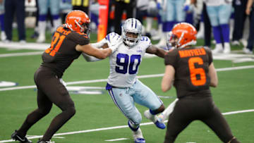 Oct 4, 2020; Arlington, Texas, USA; Dallas Cowboys defensive end DeMarcus Lawrence (90) rushes Cleveland Browns quarterback Baker Mayfield (6) in the fourth quarter at AT&T Stadium. Mandatory Credit: Tim Heitman-USA TODAY Sports