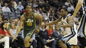 Mar 19, 2014; Memphis, TN, USA; Utah Jazz guard Alec Burks (10) drives past Memphis Grizzlies guard Tony Allen (9) during the second quarter at FedExForum. Mandatory Credit: Justin Ford-USA TODAY Sports