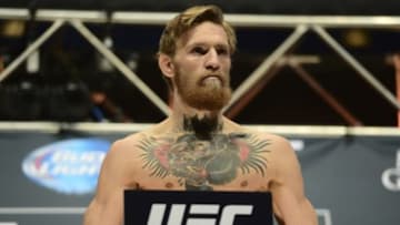 Jul 10, 2015; Las Vegas, NV, USA; Conor McGregor steps on the scale for his bout against Chad Mendes (not pictured) during weigh-ins for UFC 189 at MGM Grand Garden Arena. Mandatory Credit: Joe Camporeale-USA TODAY Sports