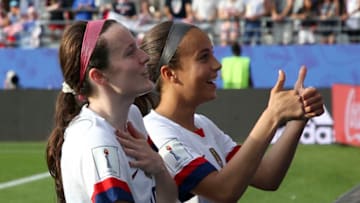 REIMS, FRANCE - JUNE 24: Rose Lavelle and Mallory Pugh of USA celebrate the victory with the supporters following the 2019 FIFA Women's World Cup France Round Of 16 match between Spain and USA at Stade Auguste Delaune on June 24, 2019 in Reims, France. (Photo by Jean Catuffe/Getty Images)