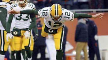 Dec 29, 2013; Chicago, IL, USA; Green Bay Packers quarterback Aaron Rodgers (12) stretches before the game against the Chicago Bears at Soldier Field. Mandatory Credit: Mike DiNovo-USA TODAY Sports