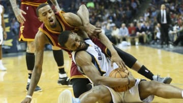 Dec 14, 2016; Memphis, TN, USA; Memphis Grizzlies guard Tony Allen (9) is fouled after gaining control of a loose ball by Cleveland Cavaliers guard Jordan McRae (12) at FedExForum. Memphis defeated Cleveland 93-85. Mandatory Credit: Nelson Chenault-USA TODAY Sports