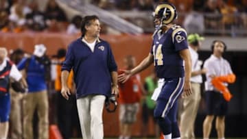 Aug 23, 2014; Cleveland, OH, USA; St. Louis Rams head coach Jeff Fisher talks to quarterback Shaun Hill (14) in the first half against the Cleveland Browns at FirstEnergy Stadium. Mandatory Credit: Rick Osentoski-USA TODAY Sports