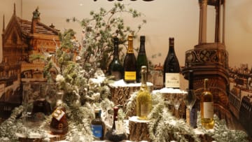 PARIS, FRANCE - NOVEMBER 17: Bottles of wine and champagne are displayed inside the windows of the 'Le Printemps Haussmann' department store illumined for Christmas and New Year celebrations on November 17, 2020 in Paris, France. Le Printemps store has been closed along with all other non-essential shops since October 30th , 2020 when France imposed another national lockdown for a minimum four weeks as part of the Covid-19 measures to fight a second wave of coronavirus disease. (Photo by Chesnot/Getty Images)