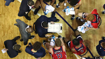 SEATTLE, WASHINGTON - JANUARY 30: Head Coach Sean Miller of the Arizona Wildcats discusses play with this team during a timeout against the Washington Huskies in the second half during their game at Hec Edmundson Pavilion on January 30, 2020 in Seattle, Washington. (Photo by Abbie Parr/Getty Images)