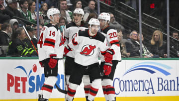 New Jersey Devils right wing Nathan Bastian (14) and left wing Miles Wood (44) and defenseman Ryan Graves (33) and center Michael McLeod (20) celebrates a goal scored by Wood against the Dallas Stars during the second period at the American Airlines Center. Mandatory Credit: Jerome Miron-USA TODAY Sports