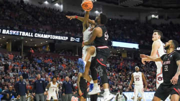 Auburn University forward Jabari Smith (10) dunks near Jacksonville State forward Brandon Huffman (50) during the second half of the NCAA Div. 1 Men's Basketball Tournament preliminary round game at Bon Secours Wellness Arena in Greenville, S.C. Friday, March 18, 2022.Ncaa Men S Basketball First Round Auburn Vs Jacksonville State