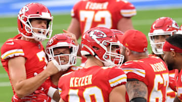 INGLEWOOD, CALIFORNIA - SEPTEMBER 20: Kicker Harrison Butker #7 of the Kansas City Chiefs celebrates with teammates after kicking the game-winning field goal against the Los Angeles Chargers during overtime at SoFi Stadium on September 20, 2020 in Inglewood, California. (Photo by Harry How/Getty Images)