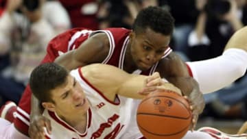 Jan 26, 2016; Madison, WI, USA; Wisconsin Badgers forward Ethan Happ (22) and Indiana Hoosiers guard Kevin Yogi Ferrell (11) fight for a loose ball at the Kohl Center. Wisconsin defeated Indiana 82-79 (OT). Mandatory Credit: Mary Langenfeld-USA TODAY Sports