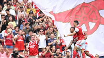 Arsenal's Gabriel Jesus (back) celebrates with Gabriel Martinelli after scoring his team's fifth goal during a club-friendly against Sevilla at the Emirates Stadium. (Photo by JUSTIN TALLIS/AFP via Getty Images)