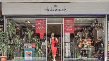 BELFAST, UNITED KINGDOM - 2021/05/31: A lady in a red dress enters Hallmark Card Shop on College Street. (Photo by Michael McNerney/SOPA Images/LightRocket via Getty Images)
