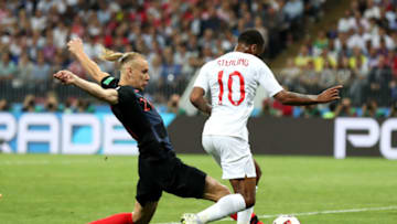 MOSCOW, RUSSIA - JULY 11: Domagoj Vida of Croatia tackles Raheem Sterling of England during the 2018 FIFA World Cup Russia Semi Final match between England and Croatia at Luzhniki Stadium on July 11, 2018 in Moscow, Russia. (Photo by Clive Rose/Getty Images)