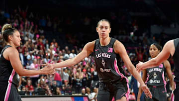 LAS VEGAS, NV - AUGUST 20: Dearica Hamby #5 of the Las Vegas Aces hi-fives teammates during the game against the Phoenix Mercury on August 20, 2019 at the Mandalay Bay Events Center in Las Vegas, Nevada. NOTE TO USER: User expressly acknowledges and agrees that, by downloading and or using this photograph, User is consenting to the terms and conditions of the Getty Images License Agreement. Mandatory Copyright Notice: Copyright 2019 NBAE (Photo by David Becker/NBAE via Getty Images)