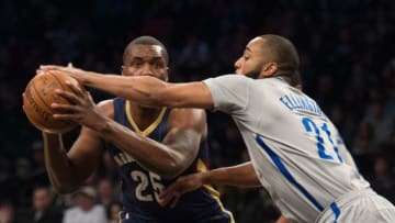 Apr 3, 2016; Brooklyn, NY, USA; Brooklyn Nets guard Wayne Ellington (21) tries to block New Orleans Pelicans guard Jordan Hamilton (25) in the first half at Barclays Center. Mandatory Credit: William Hauser-USA TODAY Sports