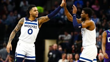 MINNEAPOLIS, MN - FEBRUARY 12: D'Angelo Russell #0 high fives Malik Beasley #5 of the Minnesota Timberwolves during the game against the Charlotte Hornets at Target Center on February 12, 2020 in Minneapolis, Minnesota. The Hornets defeated the Timberwolves 115-108. NOTE TO USER: User expressly acknowledges and agrees that, by downloading and or using this Photograph, user is consenting to the terms and conditions of the Getty Images License Agreement. (Photo by David Berding/Getty Images)